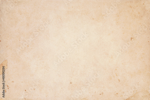 Old yellowed kraft paper with stain dots