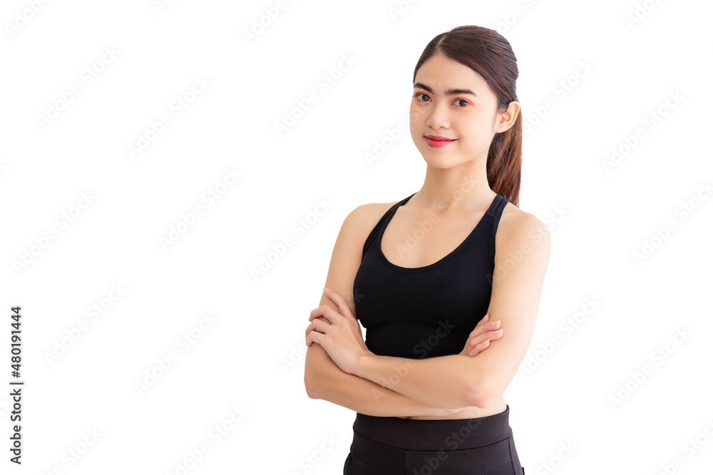 A Southeast Asian woman in black workout clothes is standing with her arms crossed. isolated on a white background A Southeast Asian woman in black workout clothes is standing with her arms crossed. isolated on a white background