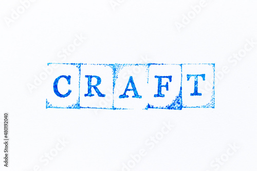 Blue color ink rubber stamp in word craft on white paper background
