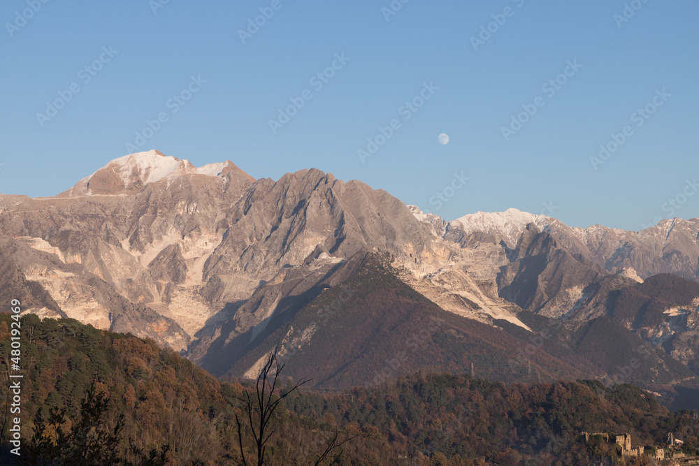 Carrara's side of the Apuan Alps with marble quarries; the Apuan Alps (Alpi Apuane in Italian) are a mountain range in northern Tuscany in Italy, known for its Carrara Marble