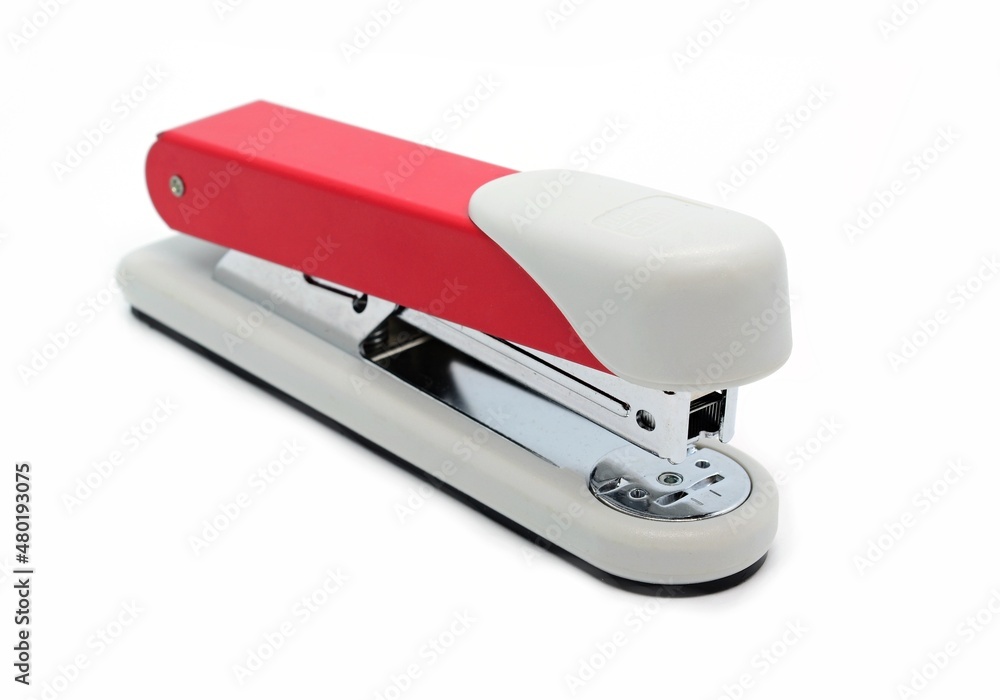 A closeup of a manual office stapler on the white background. A closeup of a manual office stapler on the white background.