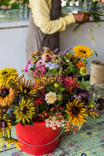 Wallpaper Mural Urban farmer creating floral farm bouquets Torontodigital.ca