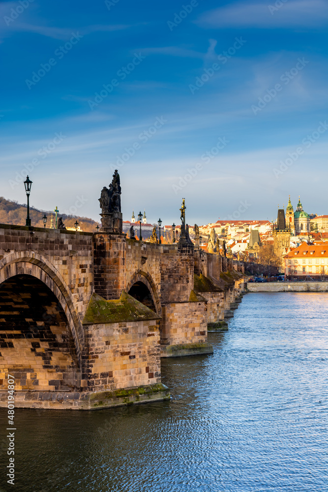 Prague in the morning, Charles Bridge reflected in the Vltava river