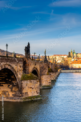 Prague in the morning, Charles Bridge reflected in the Vltava river