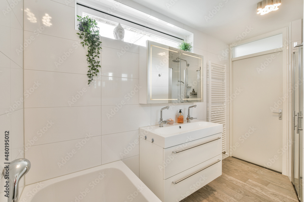 Modern bathroom interior with bathtub and sink Modern bathroom interior with bathtub and sink
