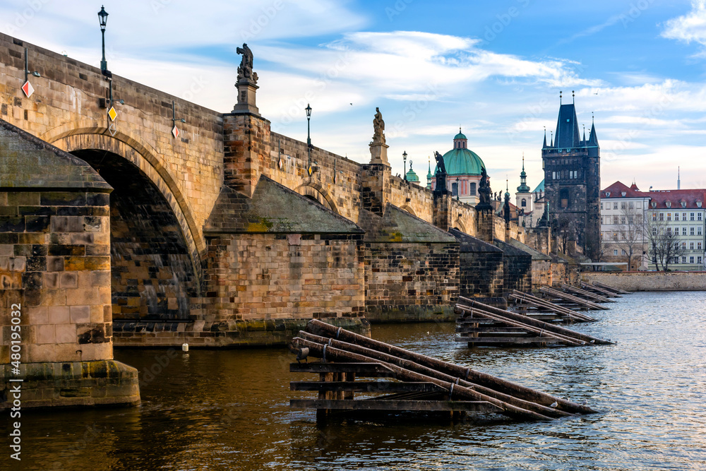 Prague in the morning, Charles Bridge reflected in the Vltava river Prague in the morning, Charles Bridge reflected in the Vltava river