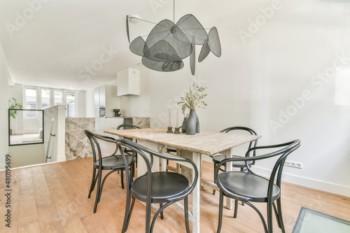 Dining table with flowers in apartment