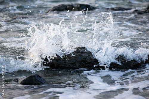 Wallpaper Mural Sea waves hitting rocks on the beach with turquoise sea water causing water splashes. Amazing rock cliff seascape in the French opal coastline. . High quality photo Torontodigital.ca