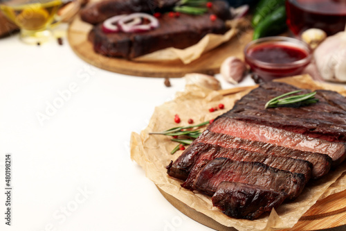 Concept of tasty food with beef steaks, space for text