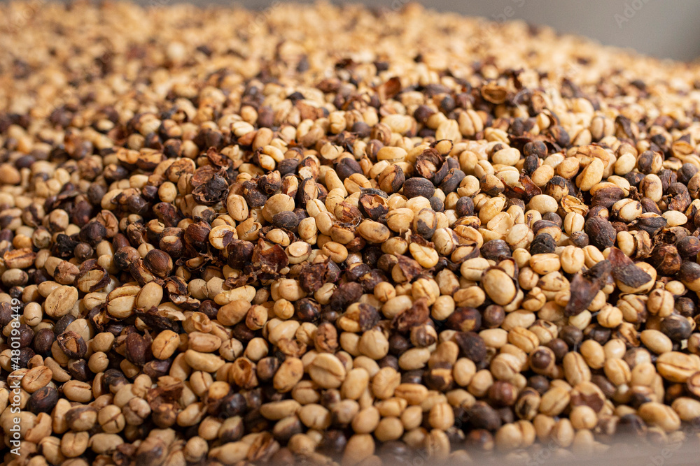 Background with coffee beans in the foreground. Background with coffee beans in the foreground.