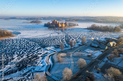 Aerial winter sunny day view of frozen Galve lake in Trakai, Lithuania photo