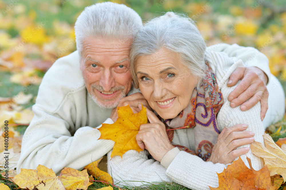 Portrait of happy senior woman and man in park Portrait of happy senior woman and man in park