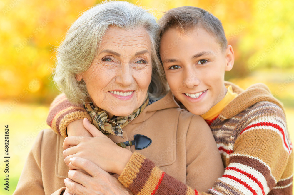 Portrait of happy grandmother and grandson posing