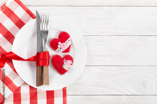 Obraz na płótnie Valentine handmade fabric hearts in plate for romantic dinner flat lay with copy-space background on white wooden table w salonie