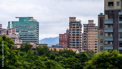 Aerial view of corporate landmark skyline and forest park in modern city Taiwan