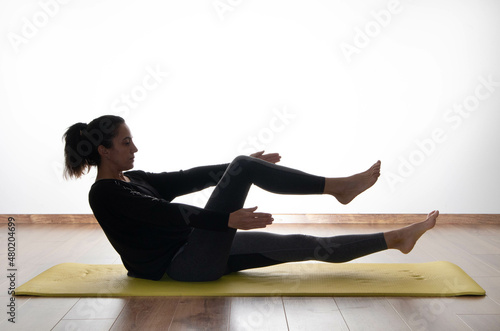 woman doing pilates, training al home. series of exercise with copy space