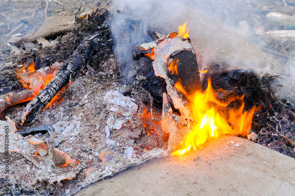 camping halt with bright fire with smoke in the fireplace outdoors camping halt with bright fire with smoke in the fireplace outdoors