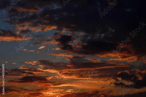 Gorgeous scenic of the sunrise or sunset with dark lining and cloud on the orange sky. Vibrant and Colorful background © Andriy Medvediuk