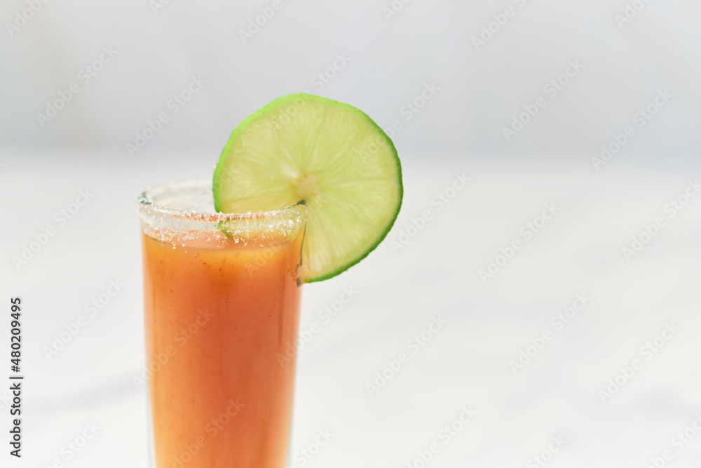Tequila shot with sangrita and lime on top. Mexican digestif for tequila. Tequila shot with sangrita and lime on top. Mexican digestif for tequila.