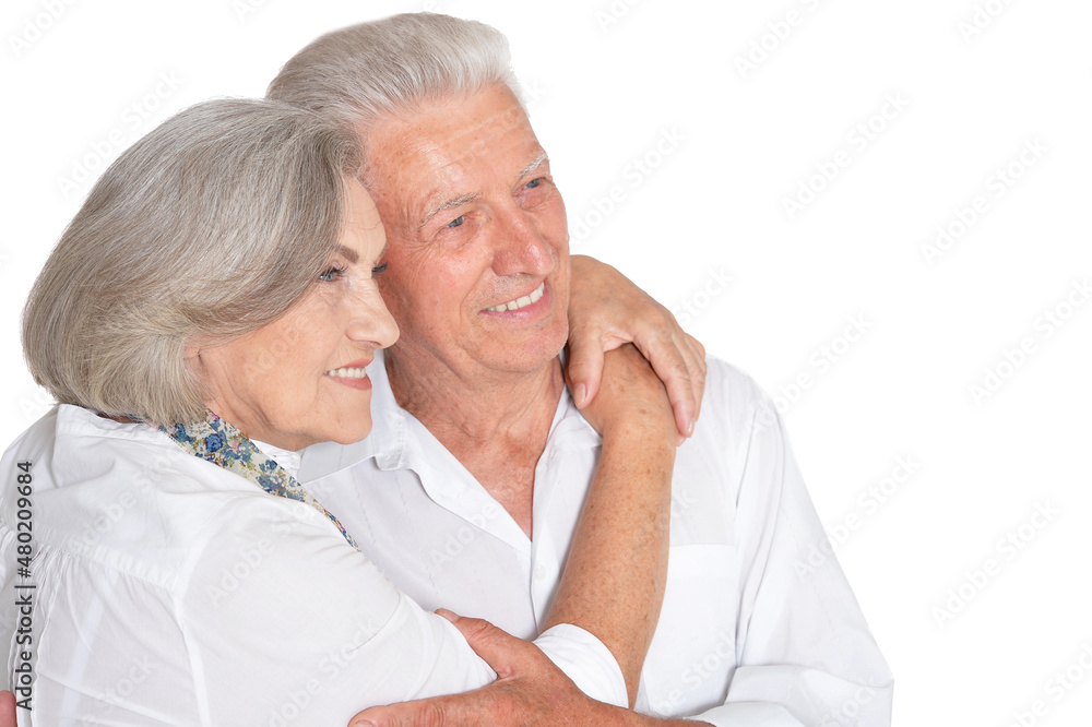 happy beautiful senior couple huging and posing on white background happy beautiful senior couple huging and posing on white background