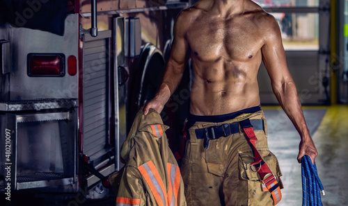 Firefighter sexy body muscle holding rope
