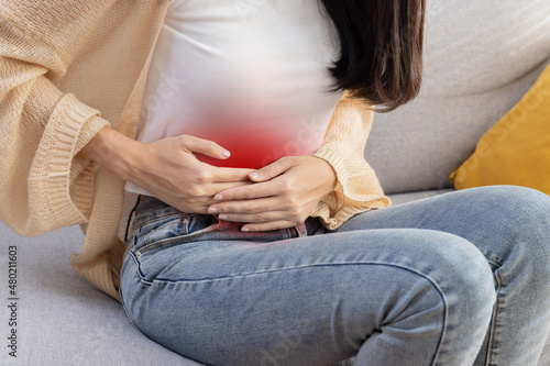 Woman Grab Her Stomach with Pain Suffer From Stomachache or Menstruation