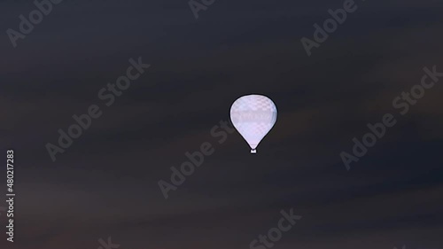 video of a hot air balloon shot in negative, black background