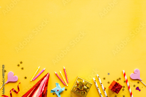 Confetti with party hats and balloons for kids birthday