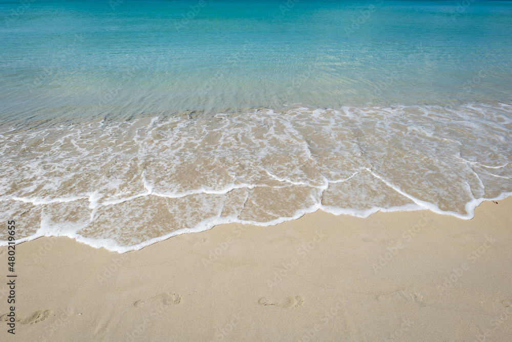 Kata beach in Phuket, Thailand, beach with clear water, white and golden sand, blue sky, in tropical vacation area.  a beach holiday  photo with copyspace.