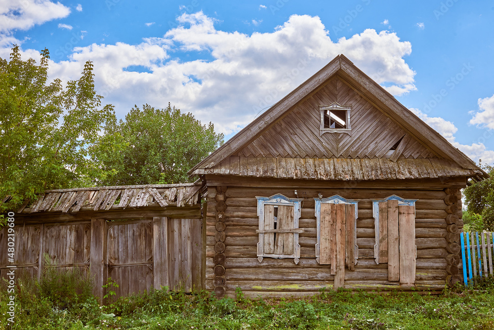 Abandoned traditional old wooden house. Summer view. Abandoned traditional old wooden house. Summer view.