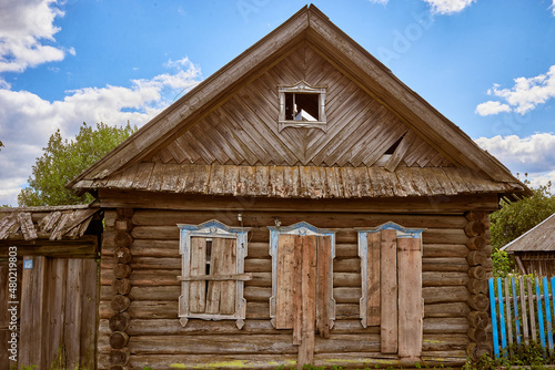 Abandoned traditional old wooden house. Summer view.