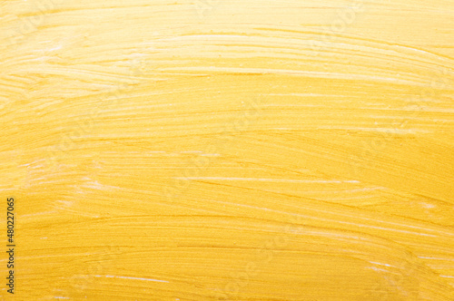 golden paint brush texture background close up