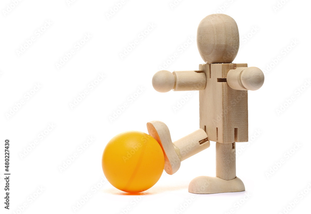Wooden man figure, doll and ball isolated on white Wooden man figure, doll and ball isolated on white