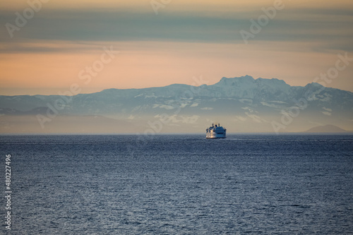Obraz na plátně ferry or ship at sunset crossing the waters of the Salish Sea with Vancouver Isl