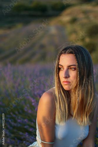 Portrait of pretty young woman posing in lavander fields © NOWRA photography