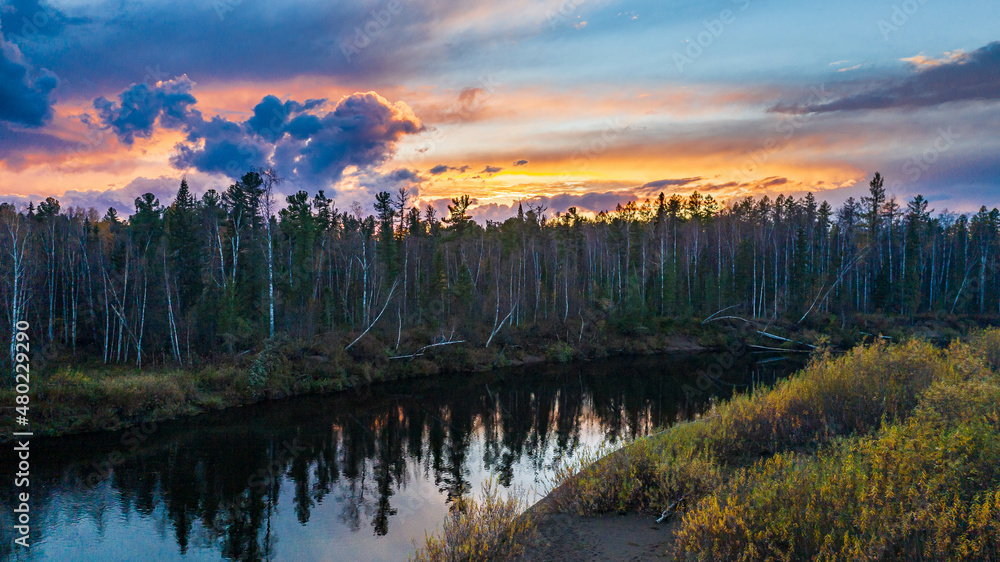 Fototapeta premium beautiful sunset in the taiga with a river