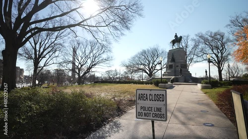 Washington, DC, USA - 12 26 2021: General William Tecumseh Sherman Statue in Presidents Park next to the White House, area closed, police line, do not cross. photo