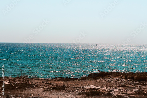 Scenic seashore of Cyprus island with blue clean water and clear sky.