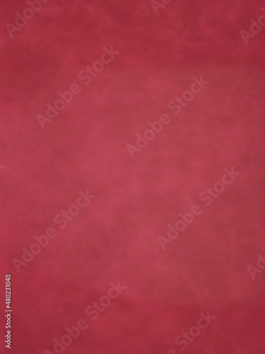 Burgundy suede surface textured as a background. High quality photo