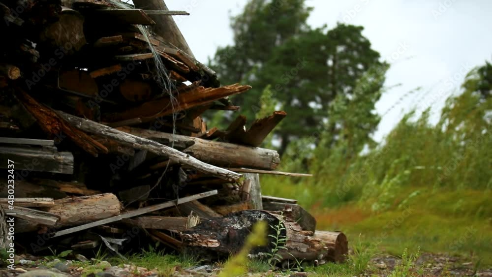 a large pile of broken trees after a tornado on a rocky river bank, desktop screensaver a large pile of broken trees after a tornado on a rocky river bank, desktop screensaver