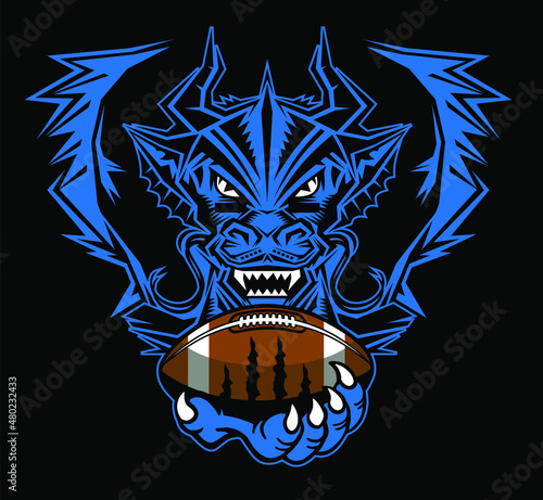 dragon mascot with wings holding football in claw for school  college or league