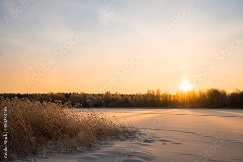 Winter landscape with sunrise. The path in the snow. 