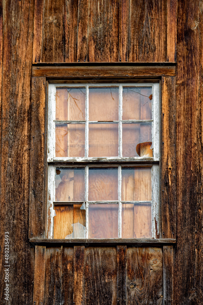 Old barn with windows broken in Oxford, NY. Well weathered barn shows wood grain. Old barn with windows broken in Oxford, NY. Well weathered barn shows wood grain.