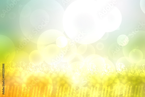 Abstract bright spring or summer landscape texture with natural green bokeh lights and yellow gold circular lights with sunshine and sun rays. Beautiful autumn background with copy space.