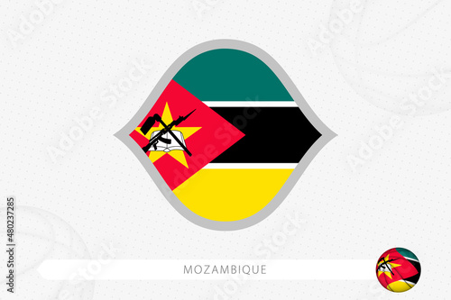 Mozambique flag for basketball competition on gray basketball background.