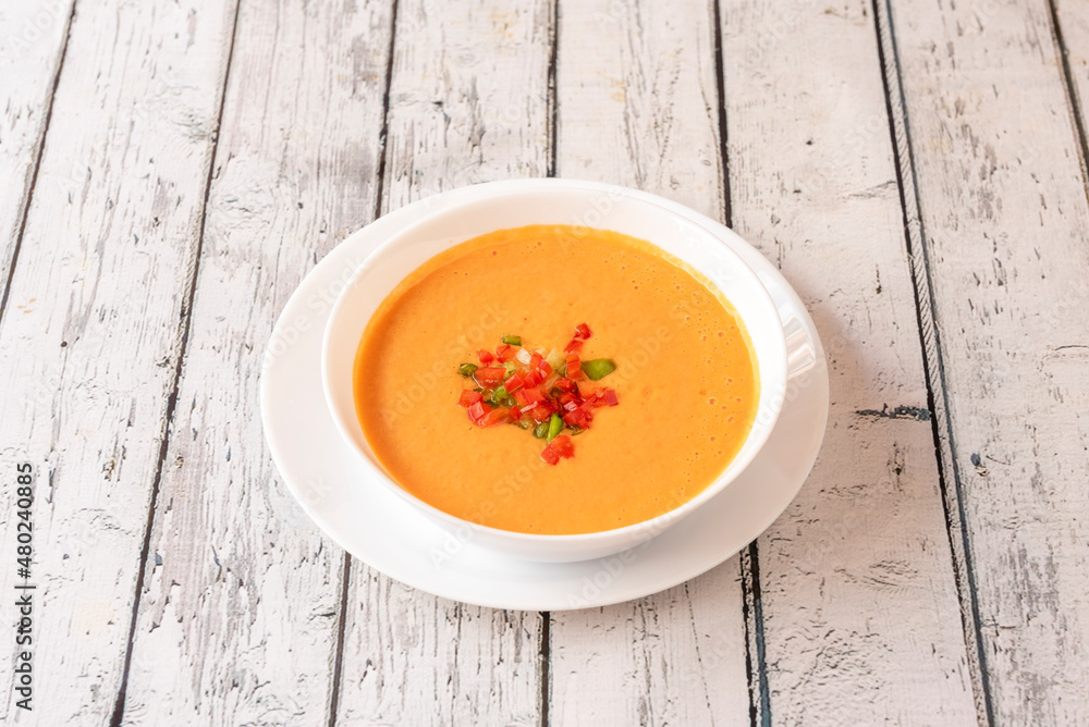 Gazpacho is a cold soup with various ingredients such as olive oil, vinegar, water, raw vegetables, usually tomatoes, cucumbers, peppers, onions, and garlic. Gazpacho is a cold soup with various ingredients such as olive oil, vinegar, water, raw vegetables, usually tomatoes, cucumbers, peppers, onions, and garlic.