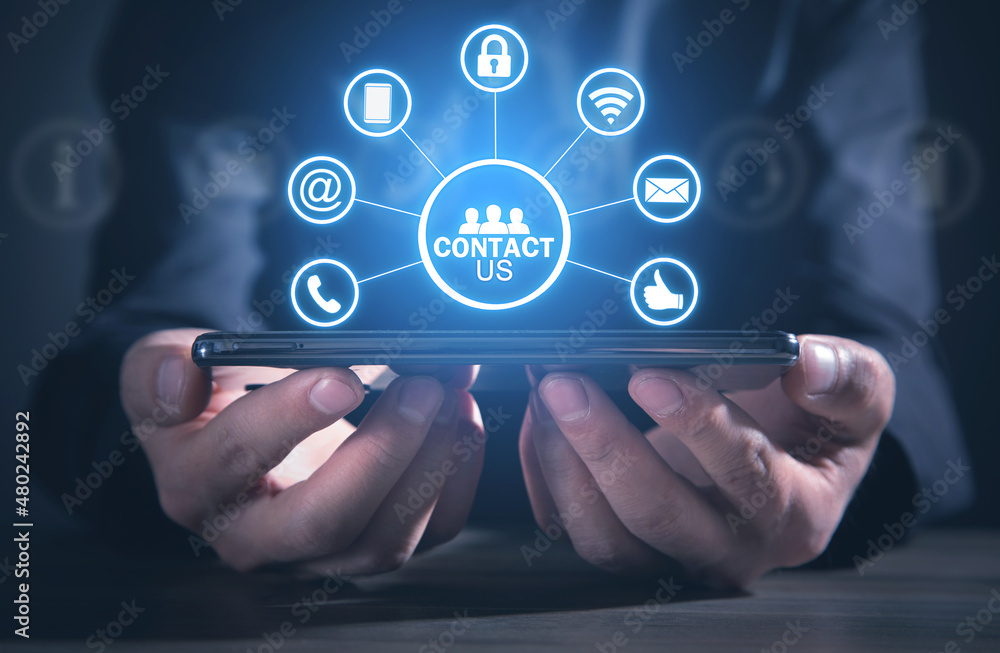 Contact us concept with a man holding smartphone. Customer support Contact us concept with a man holding smartphone. Customer support