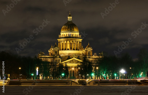 St. Isaac's Cathedral in St. Petersburg with night illumination. Winter. View across the Neva river.