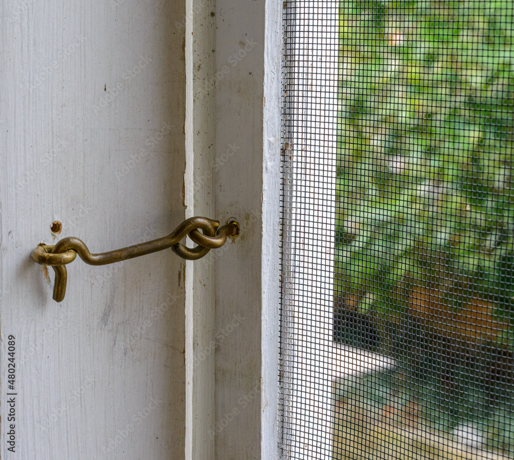 Screen door and attached hook latch with eye Stock Photo