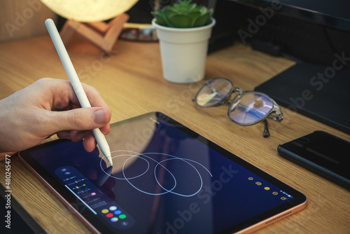 Obraz na płótnie Man using digital tablet for drawing.